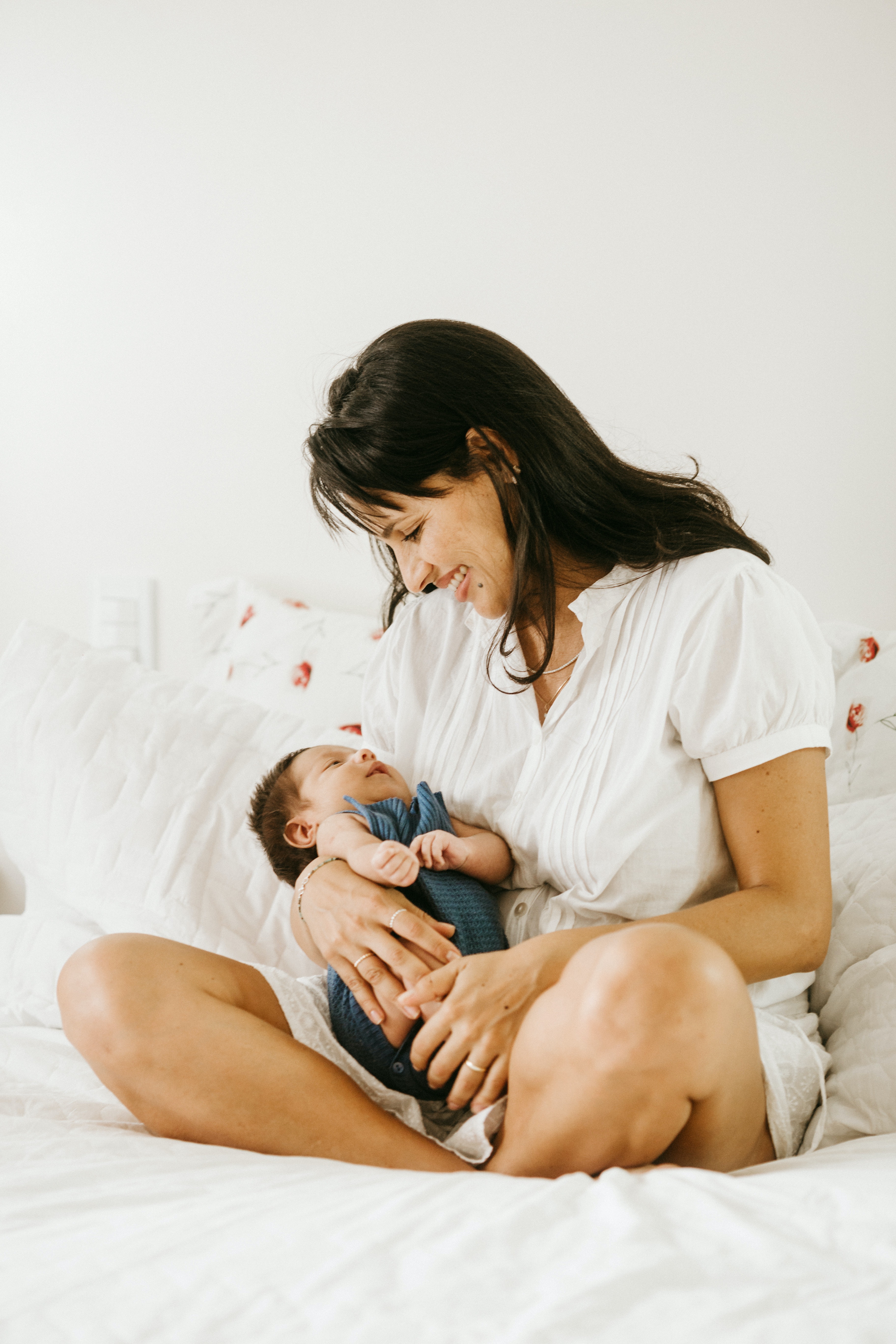 Woman playing with small baby