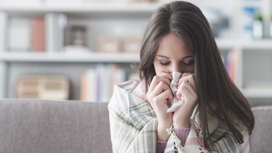 Sick woman with tissue paper