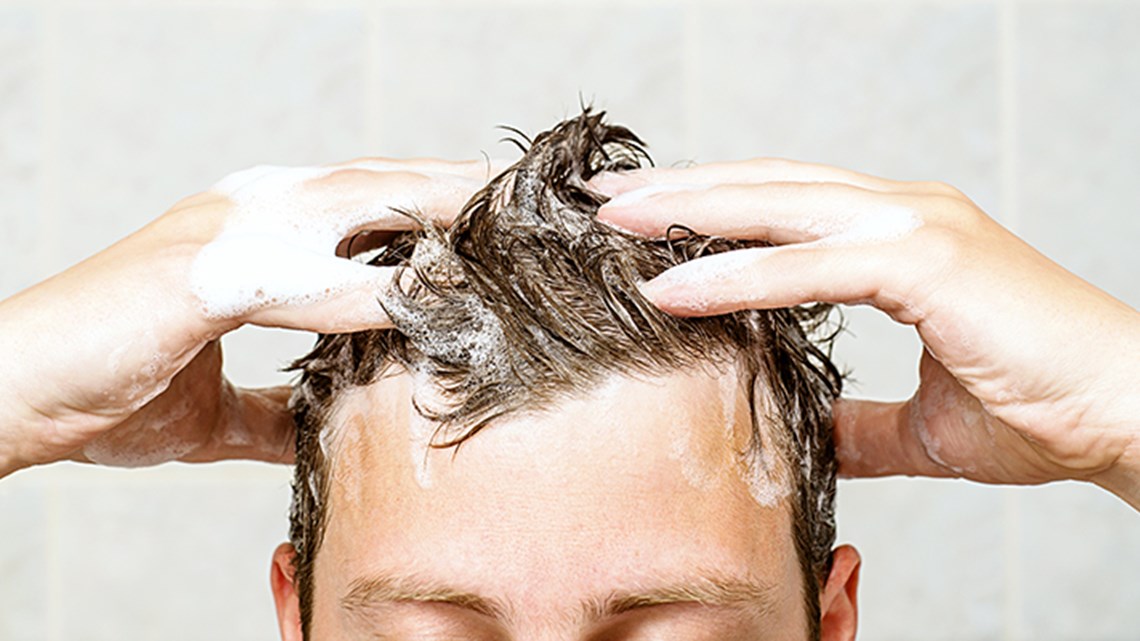 Close up of man washing head